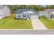 Charming single-Gathering home with a well-manicured lawn and a two-car garage at 131 Grissett Lake Dr., Conway, SC 29526