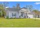 Beautifully landscaped front yard complementing this cozy home with stone accents at 131 Grissett Lake Dr., Conway, SC 29526