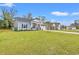 Well-maintained front yard with healthy green grass and lush landscaping surrounding the home at 131 Grissett Lake Dr., Conway, SC 29526