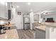 Well-lit kitchen with granite counters, stainless steel appliances, and gray cabinets at 131 Grissett Lake Dr., Conway, SC 29526