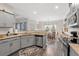 Bright kitchen featuring gray cabinets, granite counters, and stainless steel appliances at 131 Grissett Lake Dr., Conway, SC 29526