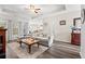 Inviting living room featuring wood floors, comfortable seating, and large windows at 131 Grissett Lake Dr., Conway, SC 29526