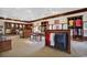 Well-stocked pro shop with golf apparel and accessories on display in custom shelving at 1526 Clubstone Dr., Conway, SC 29526