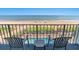 Relaxing ocean and pool view from balcony with seating at 2311 S Ocean Blvd. # 438, Myrtle Beach, SC 29577