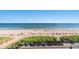 Scenic beach view from a deck with lounge chairs and tables at 2311 S Ocean Blvd. # 438, Myrtle Beach, SC 29577