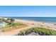 Expansive beach with ocean views, boardwalk, and lounge chairs at 2311 S Ocean Blvd. # 438, Myrtle Beach, SC 29577
