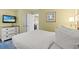 Comfortable bedroom featuring a TV and easy access to the kitchen at 2311 S Ocean Blvd. # 438, Myrtle Beach, SC 29577