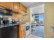 Functional kitchenette with modern appliances and dining area view at 2311 S Ocean Blvd. # 438, Myrtle Beach, SC 29577