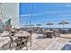 Charming outdoor dining area with tables, chairs, and umbrellas offering a relaxing space to enjoy seaside views at 2311 S Ocean Blvd. # 438, Myrtle Beach, SC 29577