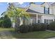 Exterior view of a two-story home with a brick facade and well-maintained landscaping at 3551 Crepe Myrtle Ct. # 3551, Myrtle Beach, SC 29577