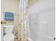 Bathroom features a toilet, shower, and seashell-themed curtain at 556 White River Dr. # 44F, Myrtle Beach, SC 29579