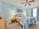 Light blue bedroom with queen bed and ceiling fan at 556 White River Dr. # 44F, Myrtle Beach, SC 29579