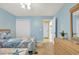 Inviting bedroom with coordinated décor, light blue walls, closet, and doorway to another room at 556 White River Dr. # 44F, Myrtle Beach, SC 29579