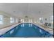Indoor pool with a vaulted ceiling and several windows for a bright atmosphere at 556 White River Dr. # 44F, Myrtle Beach, SC 29579
