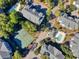 Aerial view showcasing tennis courts, community pool, and condo buildings at 601 Hillside Dr. N # 4133, North Myrtle Beach, SC 29582