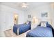 Comfortable bedroom featuring twin beds, nautical decor, and a light-filled ambiance at 601 Hillside Dr. N # 4133, North Myrtle Beach, SC 29582