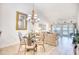 Cozy dining area and living space featuring a decorative chandelier and ample natural light at 601 Hillside Dr. N # 4133, North Myrtle Beach, SC 29582
