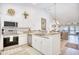 Open kitchen featuring stainless steel appliances and white cabinets, seamlessly connecting to the living space at 601 Hillside Dr. N # 4133, North Myrtle Beach, SC 29582