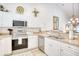 The kitchen features stainless steel appliances, white cabinets, and granite countertops, offering modern appeal at 601 Hillside Dr. N # 4133, North Myrtle Beach, SC 29582