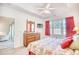 The primary bedroom offers a tray ceiling, nice wood furniture, and a large window for natural lighting at 601 Hillside Dr. N # 4133, North Myrtle Beach, SC 29582