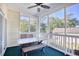 This screened porch features a ceiling fan and a lovely view of the surrounding trees and neighborhood at 601 Hillside Dr. N # 4133, North Myrtle Beach, SC 29582