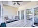 The screened-in porch offers a tranquil space with comfortable seating and view through sliding glass doors at 601 Hillside Dr. N # 4133, North Myrtle Beach, SC 29582