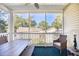 This is a beautifully screened porch with a ceiling fan and ample seating to enjoy the outdoor view at 601 Hillside Dr. N # 4133, North Myrtle Beach, SC 29582