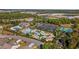 A stunning aerial view of the community pool, tennis courts, parking, and green space at 656 Pistoia Ln. # 304, Myrtle Beach, SC 29579
