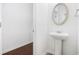 Bright bathroom features a pedestal sink and an elegantly framed mirror at 656 Pistoia Ln. # 304, Myrtle Beach, SC 29579
