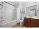 Well-lit bathroom with a shower-tub combo, white fixtures, and a tiled floor at 656 Pistoia Ln. # 304, Myrtle Beach, SC 29579