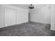 A bedroom showcasing a ceiling fan, plush carpeting, and ample closet space at 656 Pistoia Ln. # 304, Myrtle Beach, SC 29579