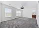 Spacious bedroom featuring plush carpeting, a ceiling fan, and natural lighting at 656 Pistoia Ln. # 304, Myrtle Beach, SC 29579