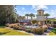 Charming community entrance featuring a water fountain, bell tower, and lush landscaping at 656 Pistoia Ln. # 304, Myrtle Beach, SC 29579