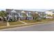 Exterior view of townhouse complex showcasing well-maintained landscaping and sidewalks at 656 Pistoia Ln. # 304, Myrtle Beach, SC 29579