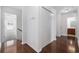 Hallway leads to various rooms with dark wood floors and neutral walls at 656 Pistoia Ln. # 304, Myrtle Beach, SC 29579