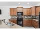 Well-equipped kitchen features dark cabinetry and modern appliances at 656 Pistoia Ln. # 304, Myrtle Beach, SC 29579