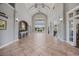 A spacious lobby with high ceilings, neutral paint colors, and beautiful tile flooring at 656 Pistoia Ln. # 304, Myrtle Beach, SC 29579
