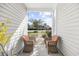 Inviting covered porch with comfortable chairs and a scenic view of the outdoors at 656 Pistoia Ln. # 304, Myrtle Beach, SC 29579