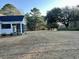 Expansive backyard with a screened-in porch; enjoy the outdoors and views of mature trees at 909 Grimes St., Georgetown, SC 29440