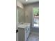 Modern bathroom featuring a white vanity with a marble countertop and a mirror at 909 Grimes St., Georgetown, SC 29440