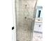 Bathroom showcasing a glass shower with marble patterned tile at 909 Grimes St., Georgetown, SC 29440