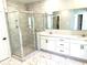 Bathroom featuring a glass shower and vanity with double sinks, drawers, and white cabinets at 909 Grimes St., Georgetown, SC 29440