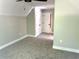 Bedroom featuring plush carpet, fresh neutral paint, and a view of the closet/hallway at 909 Grimes St., Georgetown, SC 29440