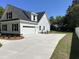 Beautiful modern farmhouse exterior featuring a driveway and manicured lawn at 909 Grimes St., Georgetown, SC 29440
