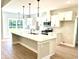 Spacious kitchen with a large island, white cabinets, and stainless steel appliances at 909 Grimes St., Georgetown, SC 29440