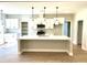 Bright, open kitchen with white cabinets, a large island, and modern pendant lighting at 909 Grimes St., Georgetown, SC 29440
