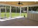 Relaxing screened-in porch with a wood ceiling, fan, and views of the backyard at 909 Grimes St., Georgetown, SC 29440