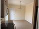 The dining room has neutral paint, tile floors, and a hanging chandelier at 1237 Spring Garden Rd., Conway, SC 29526