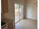The Kitchen has sliding glass door to the deck, tile floors, and neutral walls at 1237 Spring Garden Rd., Conway, SC 29526