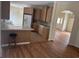 Open kitchen view with wood cabinets, tile backsplash, and bar seating area at 1237 Spring Garden Rd., Conway, SC 29526